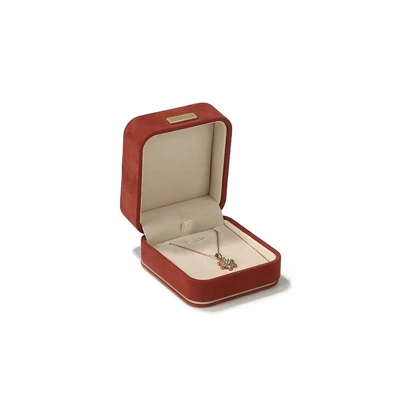 Carmine pendant box, 7.5 × 8.5 cm, open